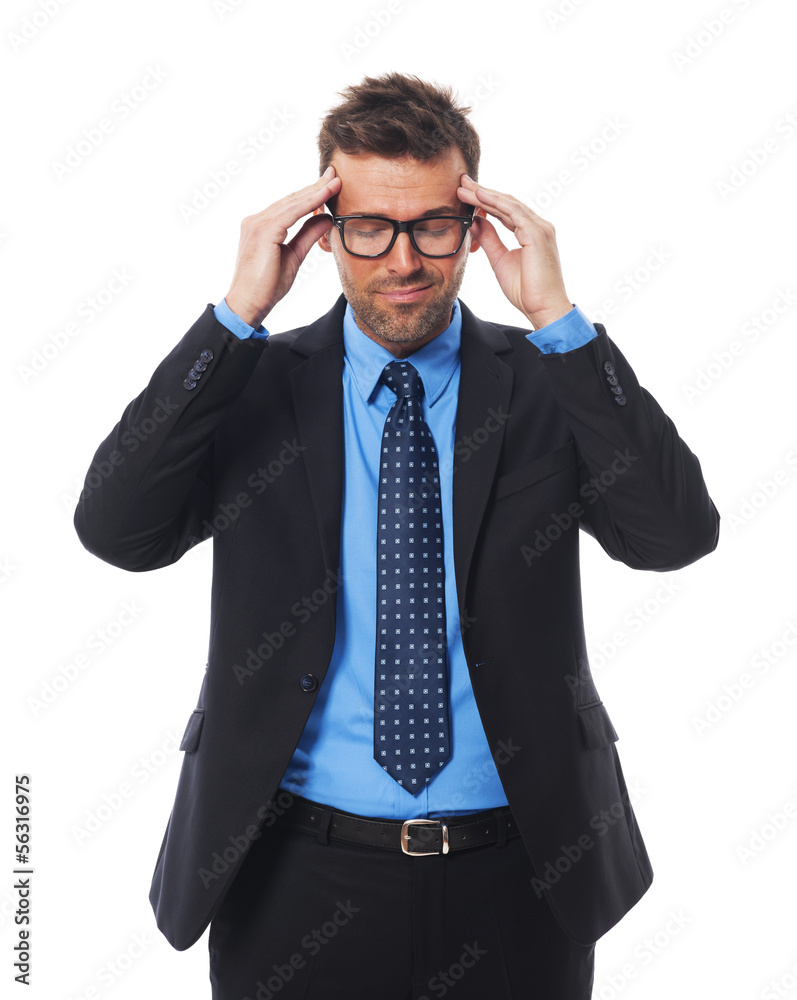 Businessman wearing glasses with awful headache Businessman wearing glasses with awful headache
