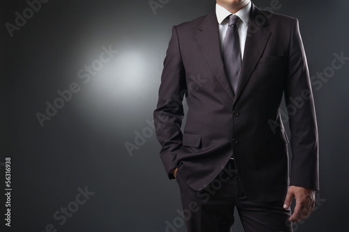 businessman in suit on gray background