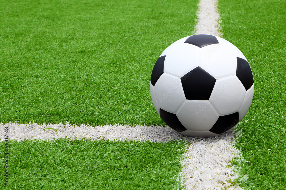 Fototapeta premium Soccer ball point on field at side line