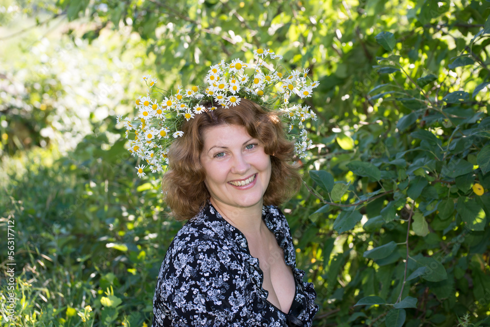 A woman with a wreath of daisies on her head A woman with a wreath of daisies on her head