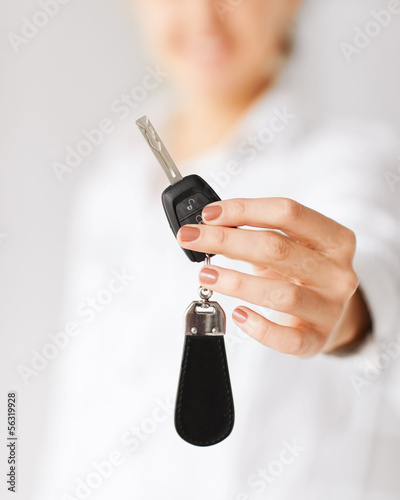 woman hand holding car key