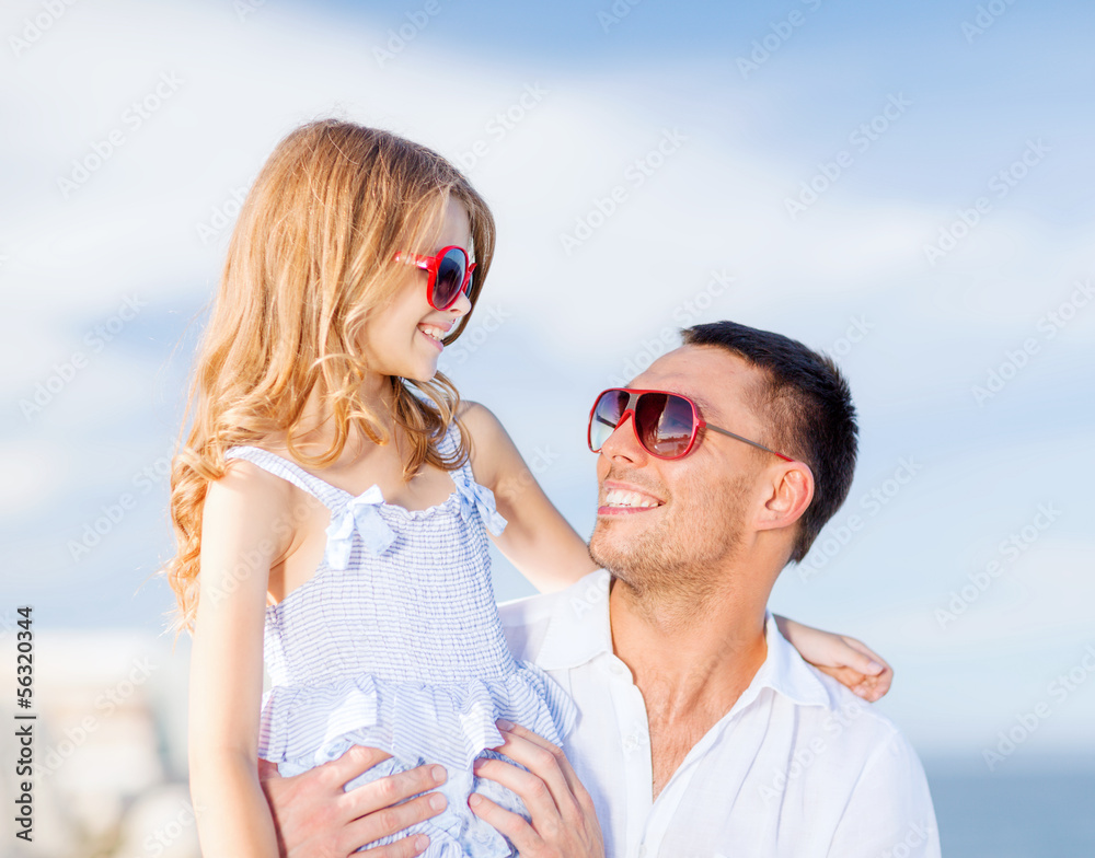 happy father and child in sunglasses over blue sky happy father and child in sunglasses over blue sky