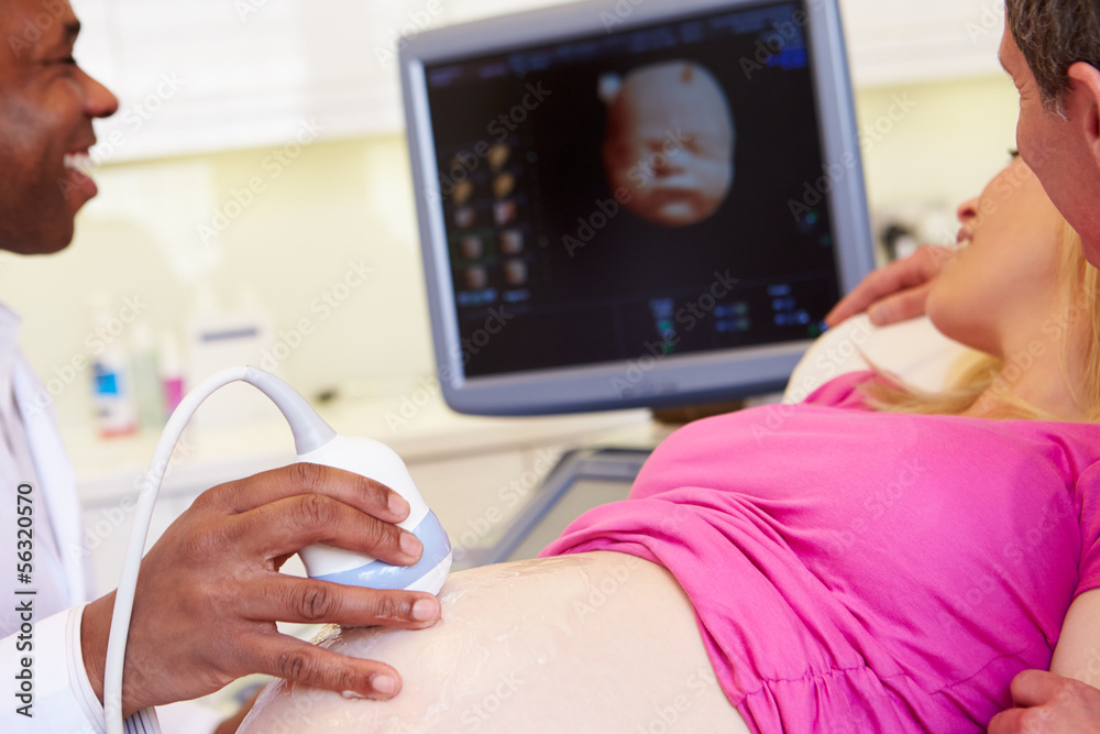 Pregnant Woman And Partner Having 4D Ultrasound Scan Pregnant Woman And Partner Having 4D Ultrasound Scan