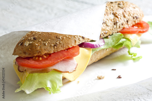 Sandwich on white paper photo