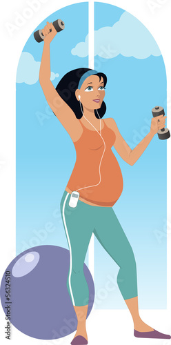 Pregnant woman exercising with dumbbells