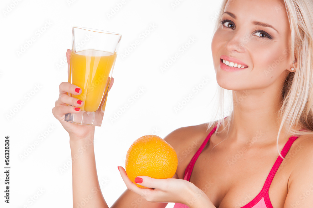 beautiful young woman with orange and glass of juice, isolated o beautiful young woman with orange and glass of juice, isolated o