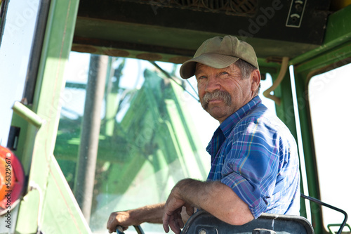 Stampa su tela Farmer in his Tractor