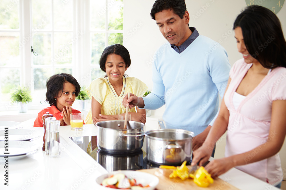 Indian Family Cooking Meal At Home