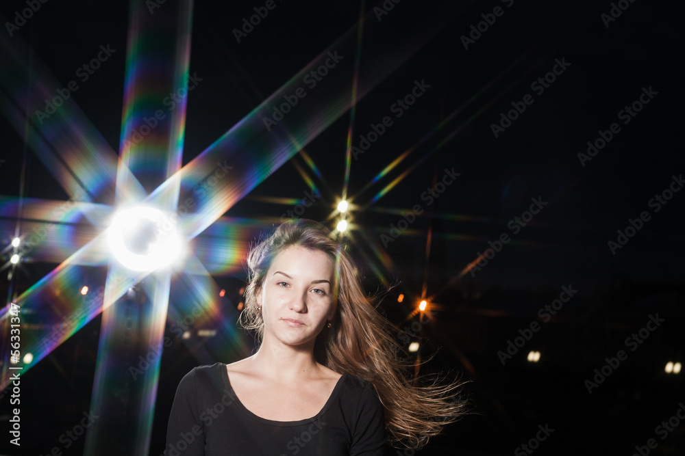 Fototapeta premium beautiful 20s girl on night city background