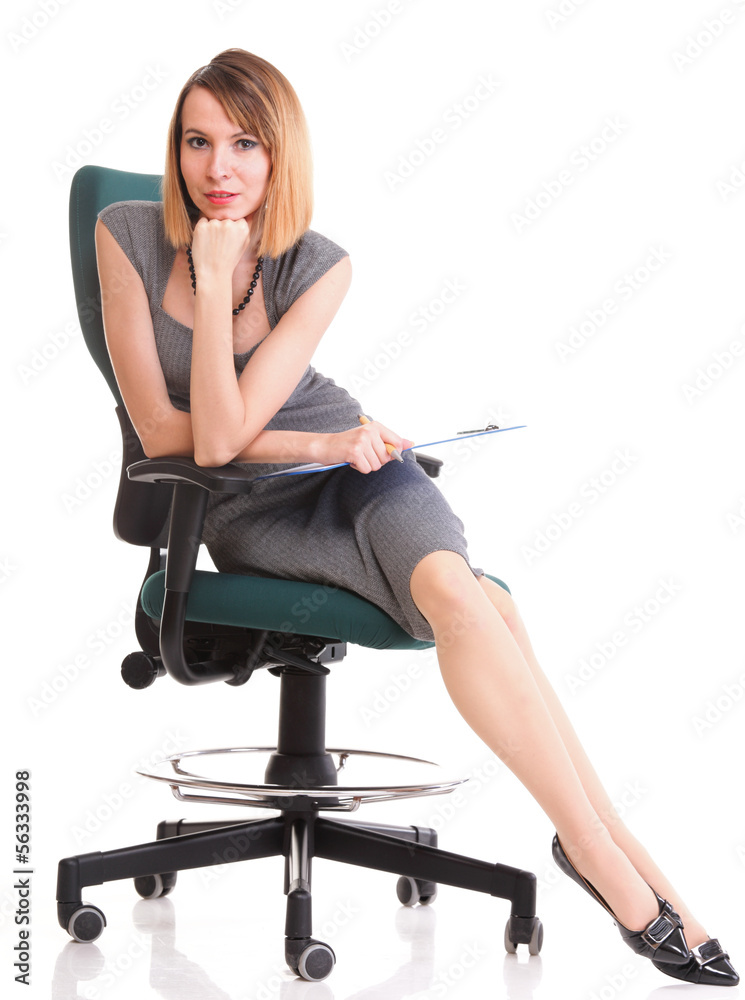 Fototapeta premium young business woman sitting with her clipboard isolated