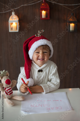 Boy, writing lettler to Santa photo