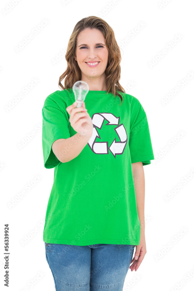 Smiling environmental activist holding light bulb Smiling environmental activist holding light bulb