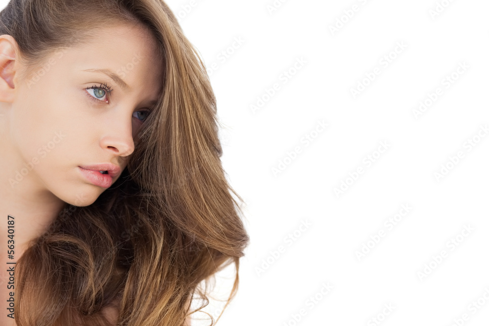 Charming brunette model posing looking away Charming brunette model posing looking away