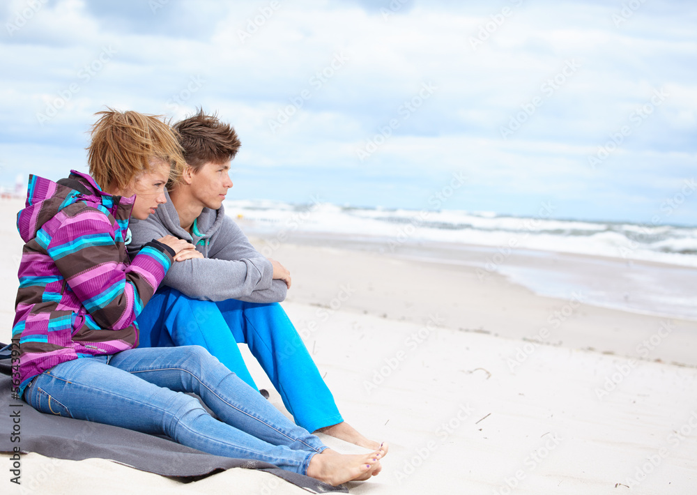 Romantic Young Couple On Winter Beach Romantic Young Couple On Winter Beach