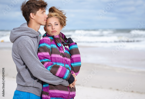 Romantic Young Couple On Winter Beach © ZoomTeam