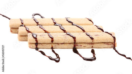 Tableau sur toile Stream chocolate on stics of biscuit.