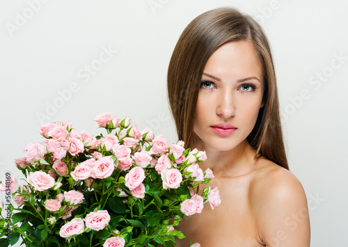 Beauty Woman with Long Healthy and Shiny Smooth Brown Hair. isol