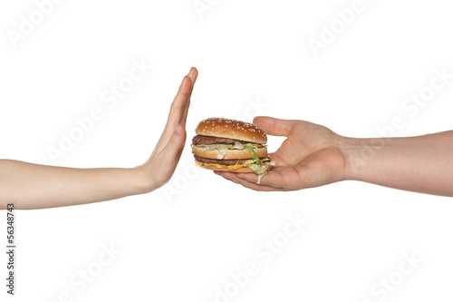Female hand refusing the fast food meal