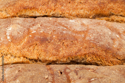 loaves of bread traditionally roasted. Background. Close up.