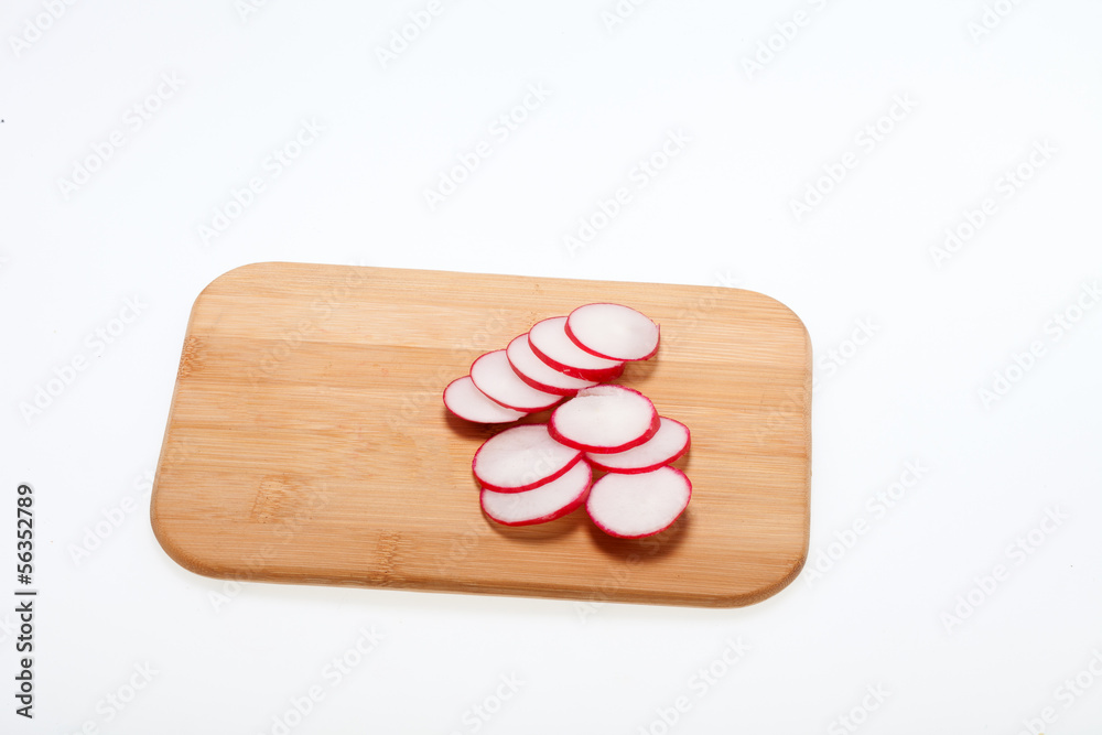 Garden radish on wooden board Garden radish on wooden board