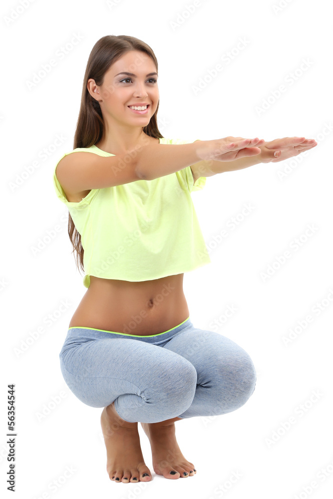 Young beautiful fitness girl doing yoga exercise isolated Young beautiful fitness girl doing yoga exercise isolated