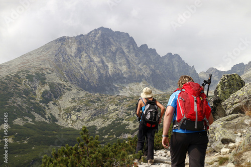 Mountaineers hiking in mountain range of High Tatras in Slovakia