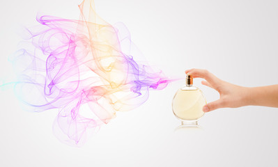woman hands spraying perfume