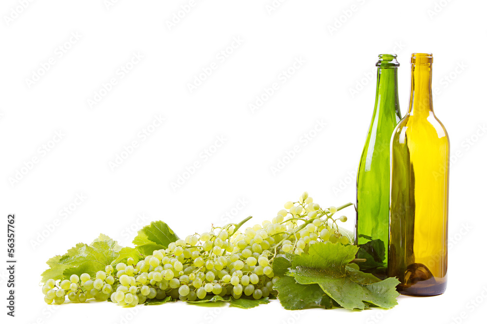 Fototapeta premium grapes and bottles on white