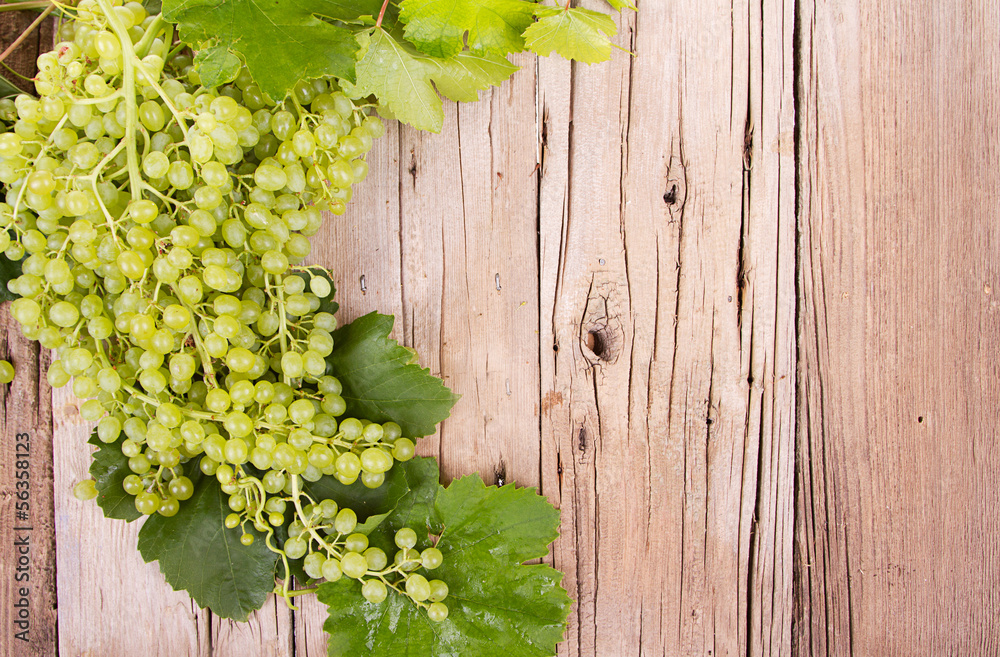 grapes on wooden plank grapes on wooden plank