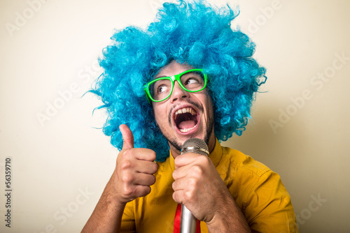 crazy funny young man with blue wig
