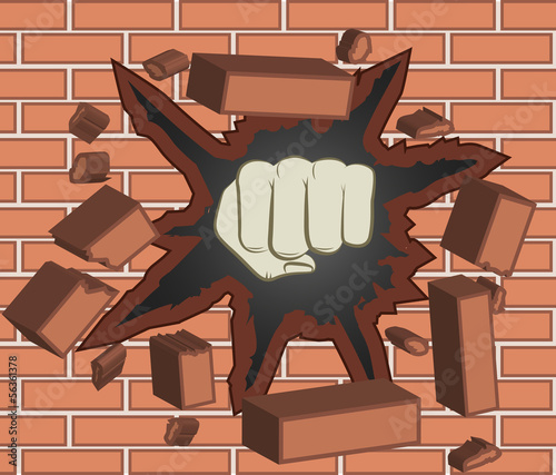 Fist breaking through brick wall