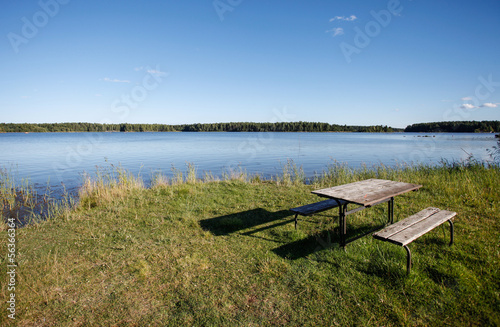 picnic table at lake © Alex Koch