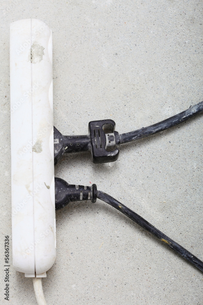 electrical cords connected to power strip building site