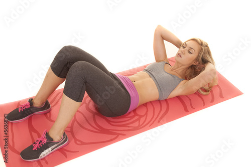 Woman sit up red yoga mat