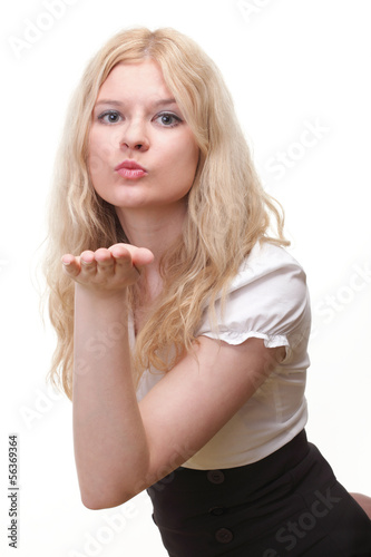 beautiful young woman blowing a kiss