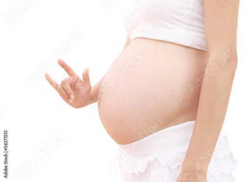 Love sign hand abdomen of pregnant woman on white background.