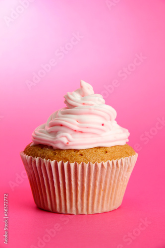 tasty cupcake, on pink background