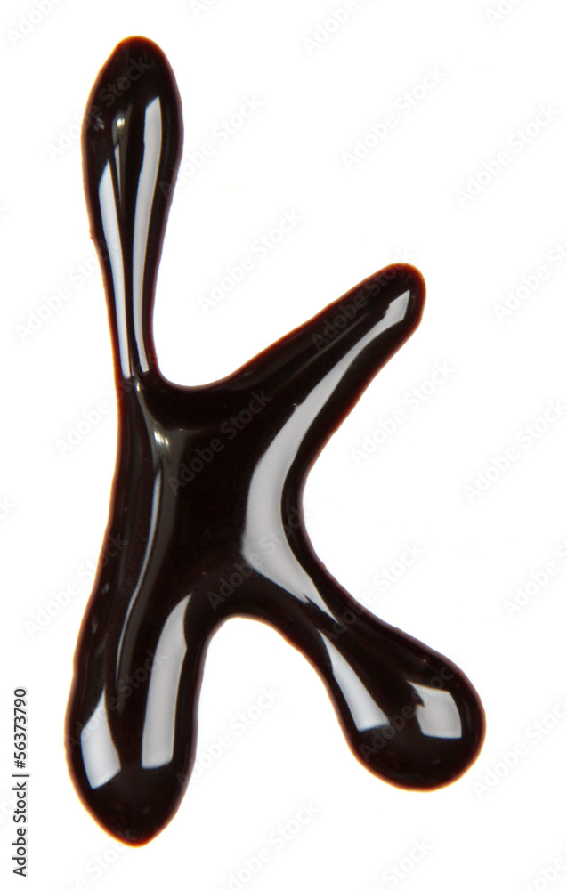 Small letter of alphabet made from chocolate syrup, isolated Small letter of alphabet made from chocolate syrup, isolated