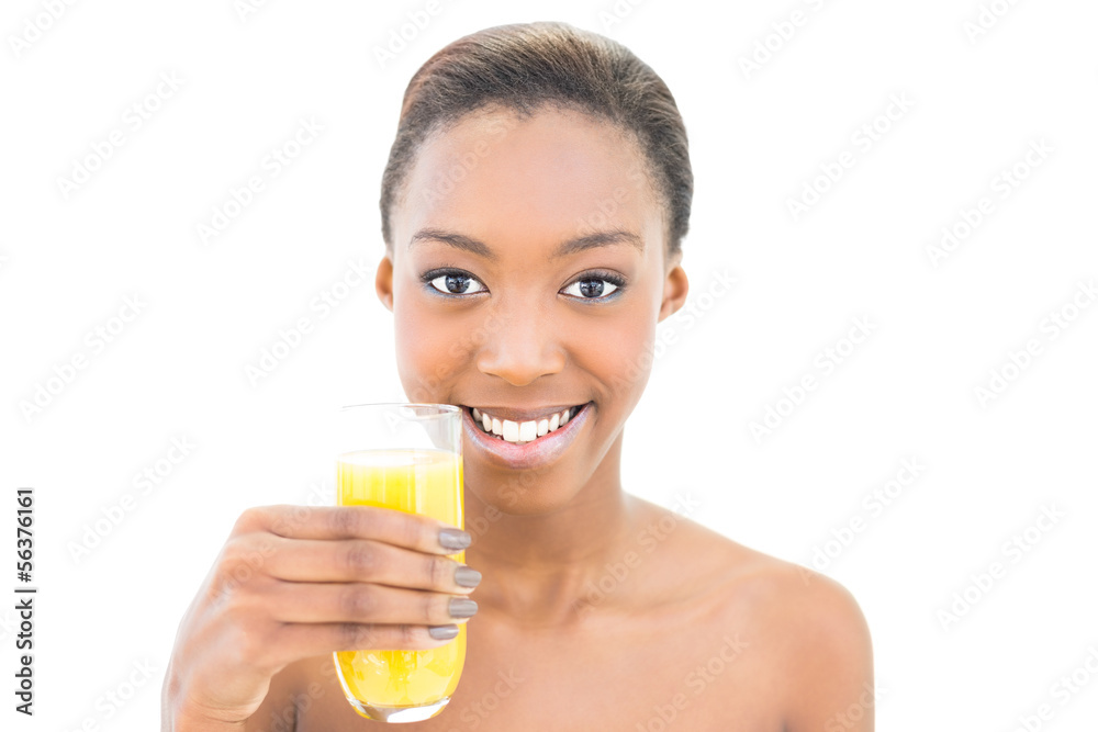 Smiling natural beauty holding glass of orange juice Smiling natural beauty holding glass of orange juice