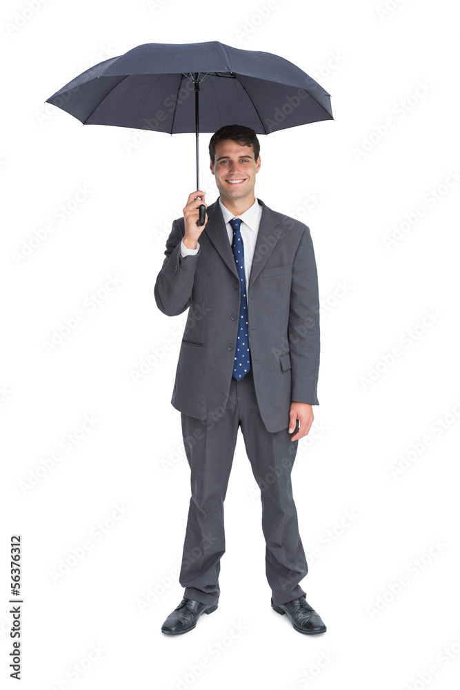 Happy businessman holding grey umbrella Happy businessman holding grey umbrella