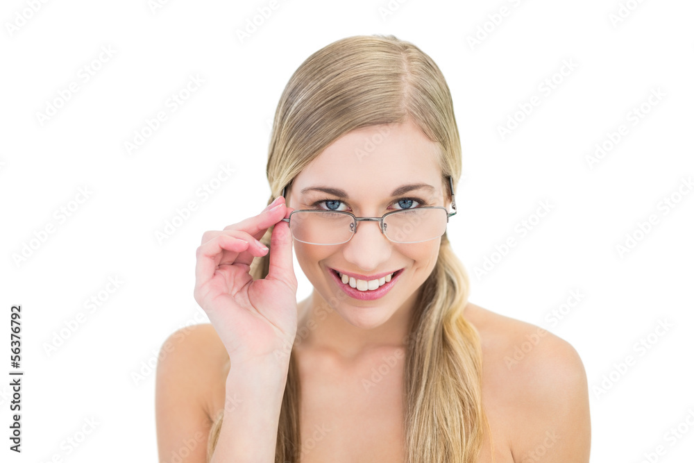 Seductive young blonde woman looking over her glasses Seductive young blonde woman looking over her glasses