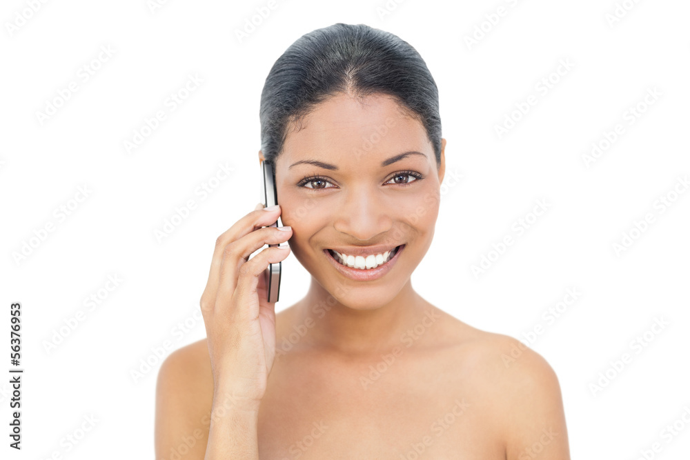 Smiling black haired model on the phone Smiling black haired model on the phone