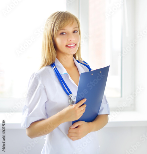 female doctor holding a notepad