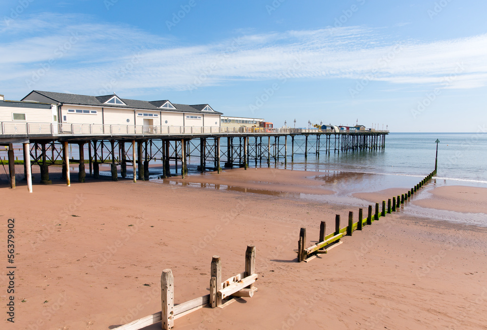 English Pier with blue sky and sandy beach