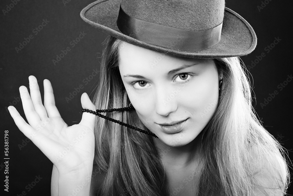 Obraz premium The beautiful girl against a dark background blue eyes