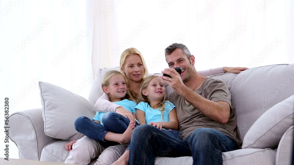 Father taking self portrait of him with family Father taking self portrait of him with family