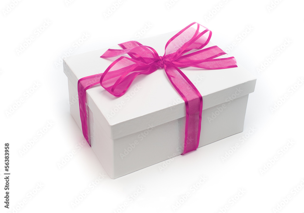 Obraz premium Christmas present wrapped with a pink ribbon and bow.