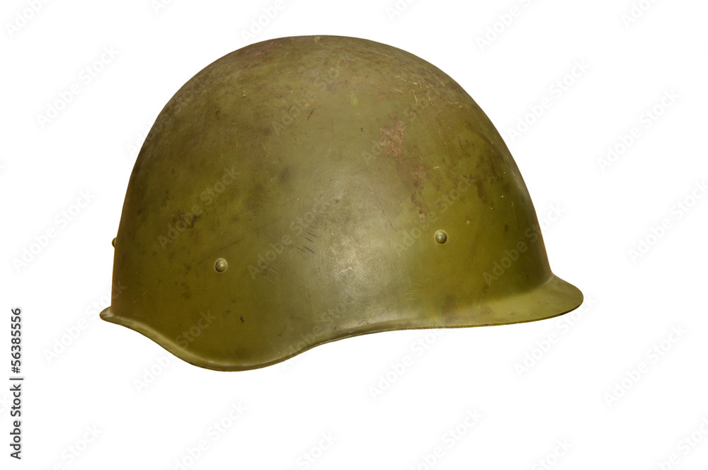 Fototapeta premium The old military helmet, isolated on white.
