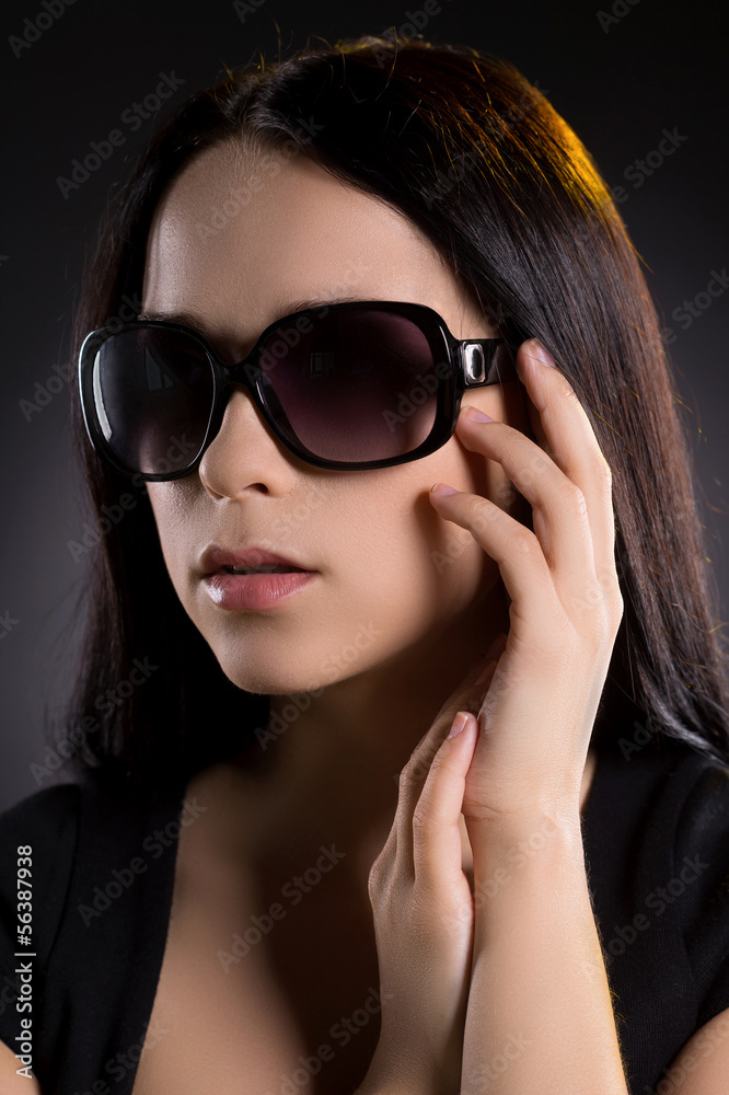 Woman in sunglasses. Attractive young woman in sunglasses lookin Woman in sunglasses. Attractive young woman in sunglasses lookin