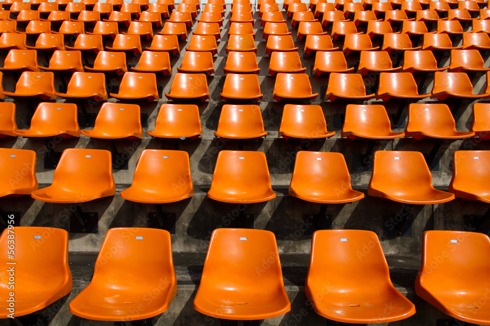 Naklejka premium Front of the orange seats on the stadium
